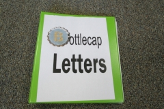 Literacy Center Bottle Cap Letters Preschool Classroom Set up!