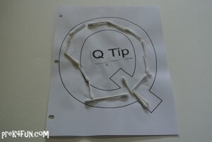 Q tips cut and whole, glued to paper.