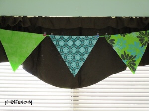 Use Ribbon to drape across. Hang fabric over ribbon and secure with a binder clip on each corner.