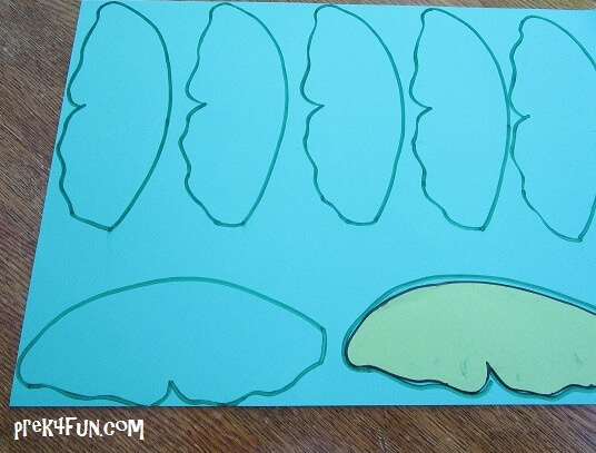 I used a lily pad outline to make 10 lily pads. Then cut them out of green paper. I also made a set cut out of foam paper to use for a sensory table game.