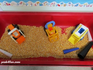 Letter D Preschool Art and Activities sensory Digging in corn! 