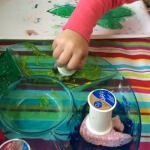 When finished with tape sponge the paint mixing colors for added fun and learning. Set aside to dry, then carefully pull the tape off revealing their design! Finish with their photo and add to the board! 4
